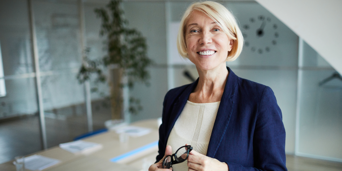 happy professional woman in navy blazer